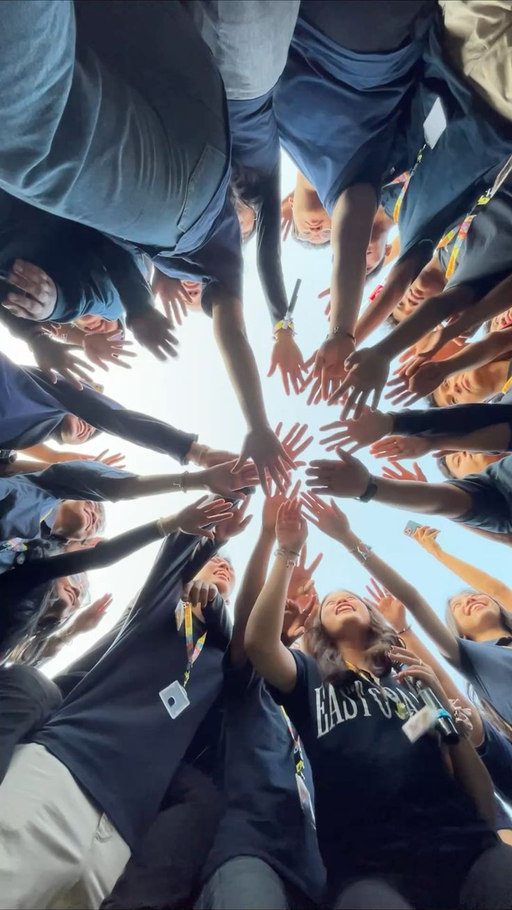 Young people joining hands in unity